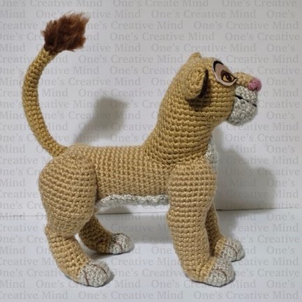 A knitted lion toy

Description automatically generated