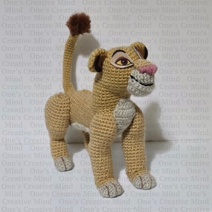 A knitted lioness toy

Description automatically generated